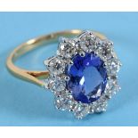 An 18ct gold, tanzanite and diamond cluster ring, the tanzanite approx. 2.46ct, the diamonds approx.