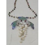 A silver, enamel and pearl dragonfly necklace