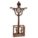 A late 19th/early 20th century Black Forest hall stand, having an eagle surmount above an oval