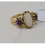 A 14ct gold, white opal and amethyst three stone ring, approx. ring size P½