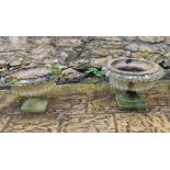 A pair of reconstructed stone garden urns, some damage, 41 cm high (2)