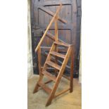 A pair of library oak steps, 48 cm wide Top part of grab rail has been repaired. Some worm to the