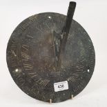 A 19th century bronze sundial, inscribed with the motto 'Seize the present moment....', 25 cm