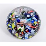 A St Louis scrambled glass small paperweight, circa 1850, with multi coloured various canes, 5.5