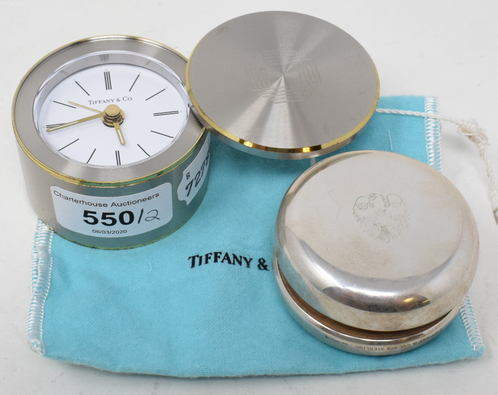 A Tiffany sterling silver yoyo with corporate banking emblems, and a Tiffany quartz clock, with a