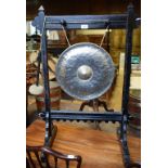 A late Victorian gong, in an ebonised frame, 64 cm wide Report by PM The diameter of the gong is