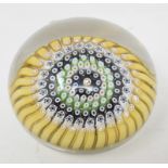 A Whitefriars Millefiore glass paperweight, with multi coloured canes and central star