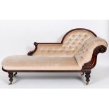 A Victorian mahogany scroll end chaise longue, carved a lion face mask and mane, on turned legs