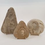 A carved stone, of triangular form, decorated a figure, 22 cm high, and two other stone carvings (3)