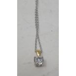 An 18ct white gold and diamond solitaire pendant and chain, the diamond approx. 0.75ct