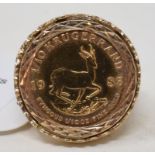 A South Africa 1/10 krugerrand, 1983, in a 9ct gold ring mount Report by RB Approx. 8.1 g