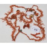 WITHDRAWN: A three strand coral necklace, a pair of coral earrings, and other coral jewellery