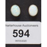 A pair of 9ct gold and gilson opal earrings