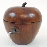 A painted treen tea caddy, in the form of an apple, 11.5 cm high Report Modern