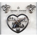 A Georg Jensen double dolphin heart shaped brooch, designed by Arno Malinowski, no. 312, with a