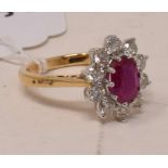 An 18ct gold, ruby and diamond cluster ring, the rubies approx. 1.50ct, the diamonds approx. 1.00ct,