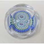 A Whitefriars Millefiore glass paperweight, with faceted sides and multi coloured circles of canes