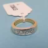 An 18ct gold and diamond channel set ring, diamonds approx. 1.01ct, approx. ring size M