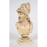 A late 19th century carved ivory bust, of a Greek god, on a base, probably Dieppe, 15.5 cm high