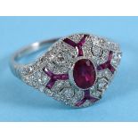 A platinum Victorian style ruby and diamond ring in a filigree style mount, approx. ring size N