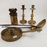 A pair of cast brass candlesticks, 21 cm high, two ladles, a chamberstick, and a candle holder (6)