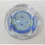 A Whitefriars Millefiore glass paperweight, with faceted sides and multi coloured circles of canes
