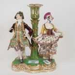 A 19th century porcelain figural candlestick, possibly Derby, some loss, 22.5 cm high