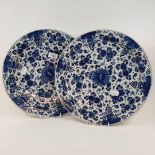 A pair of Dutch delft chargers, with floral decoration in underglaze blue, 35.5 cm diameter (2) Some