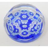 A Whitefriars glass paperweight, with faceted circles and inset with floral garlands, boxed