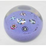 A Paul Ysart glass paperweight, the purple ground decorated with six groups of coloured canes, 7.5