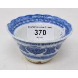 An 18th century Chinese blue and white tea bowl, with scalloped border with hand painted and moulded