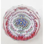 A Whitefriars Millefiore glass paperweight, with multi faceted decoration, one cane dated 1971