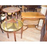 An Edwardian carved oak two tier occasional table, 41 cm diameter, a brass top table and an