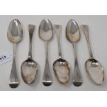 A set of six George II silver Old English pattern table spoons, engraved armorials, London 1743/