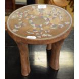 An ethnic stool, inlaid with beads, 26 cm diameter