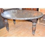 A Victorian oak oval extending dining table, inset two extra leaves, 238 cm wide