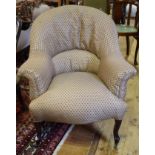 A late 19th century button back armchair, on cabriole front legs