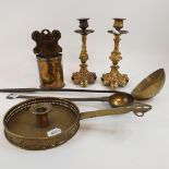 A pair of cast brass candlesticks, 21 cm high, two ladles, a chamberstick, and a candle holder (6)