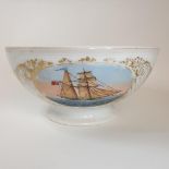 A 19th century porcelain bowl, painted a vignette of a two masted sailing ship, 28 cm diameter