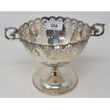 A silver pedestal bowl, with a pierced border and scroll handles, Birmingham 1929, approx. 11.4 ozt,