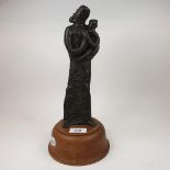 A 20th century bronze study, of a mother and child, on a wooden base, 32 cm high (overall)