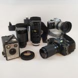 A Canon T70 camera, other assorted cameras, lenses and accessories (qty)