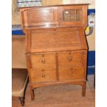 An Arts & Crafts oak bureau cabinet, 92 cm wide Lacks three quarter gallery to top.