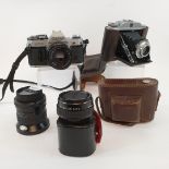 A Canon AE-1 camera, another, various lenses, accessories, and other cameras, (box)