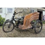 A 1911 Bradbury De Luxe Flat Tank Combination Registration number DS 6843 Wicker single chair