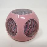A Strathearn paperweight, with pink overlay circular cut windows, with inset cane inscribed S and
