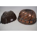 A Victorian oval copper jelly mould, 22 cm wide, and another similar, 24 cm wide (2)