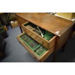 A part table service of silver plated cutlery, in a mahogany table, having five drawers, 132 cm wide