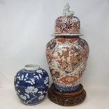A Chinese ginger jar, decorated prunus in underglaze blue, four character mark, 18 cm high, and a