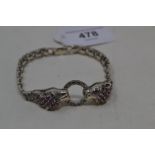 A silver and ruby set panther bracelet Good condition modern
